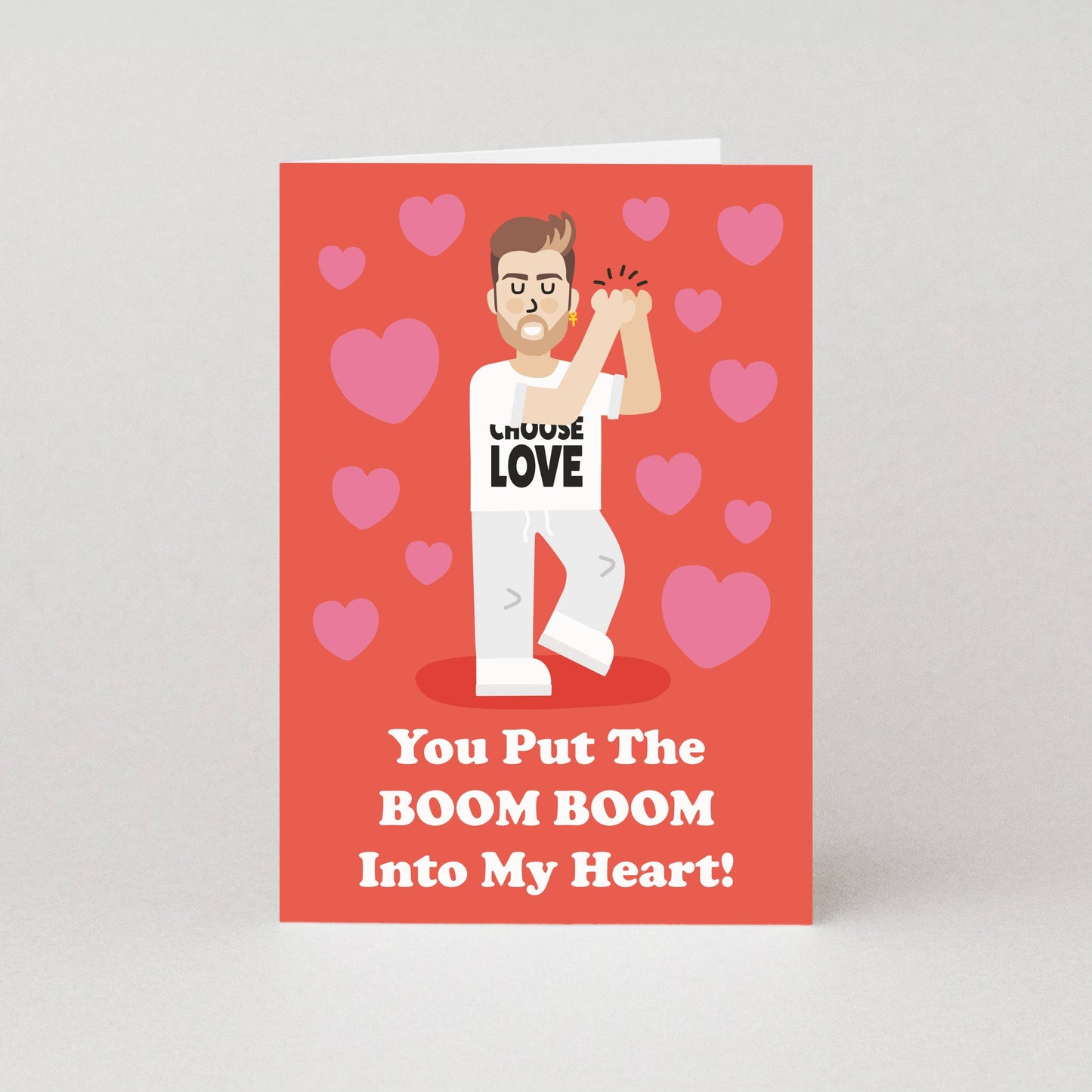 Card with a George Michael look alike holding a boom box and hearts on a red background