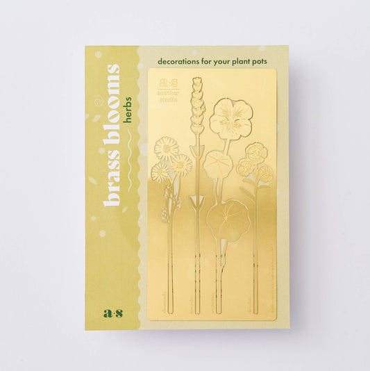A set of brass plant decorations in the shapes of various flowers to be decorations for your plant pots by Another Studio