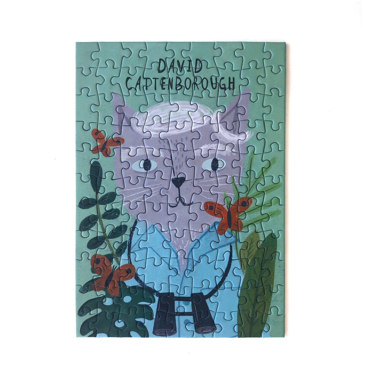 99 piece jigsaw Puzzle of David Cattenborough on a blue background