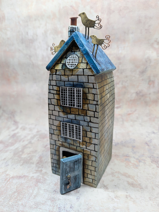 Frances Noon house blue roof and dog at the door