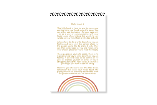 A white, wire-bound notebook with a pink cover featuring the title 'Worry Notes' in red text, along with a small decorative element on the top right by LSW for Heart Gallery