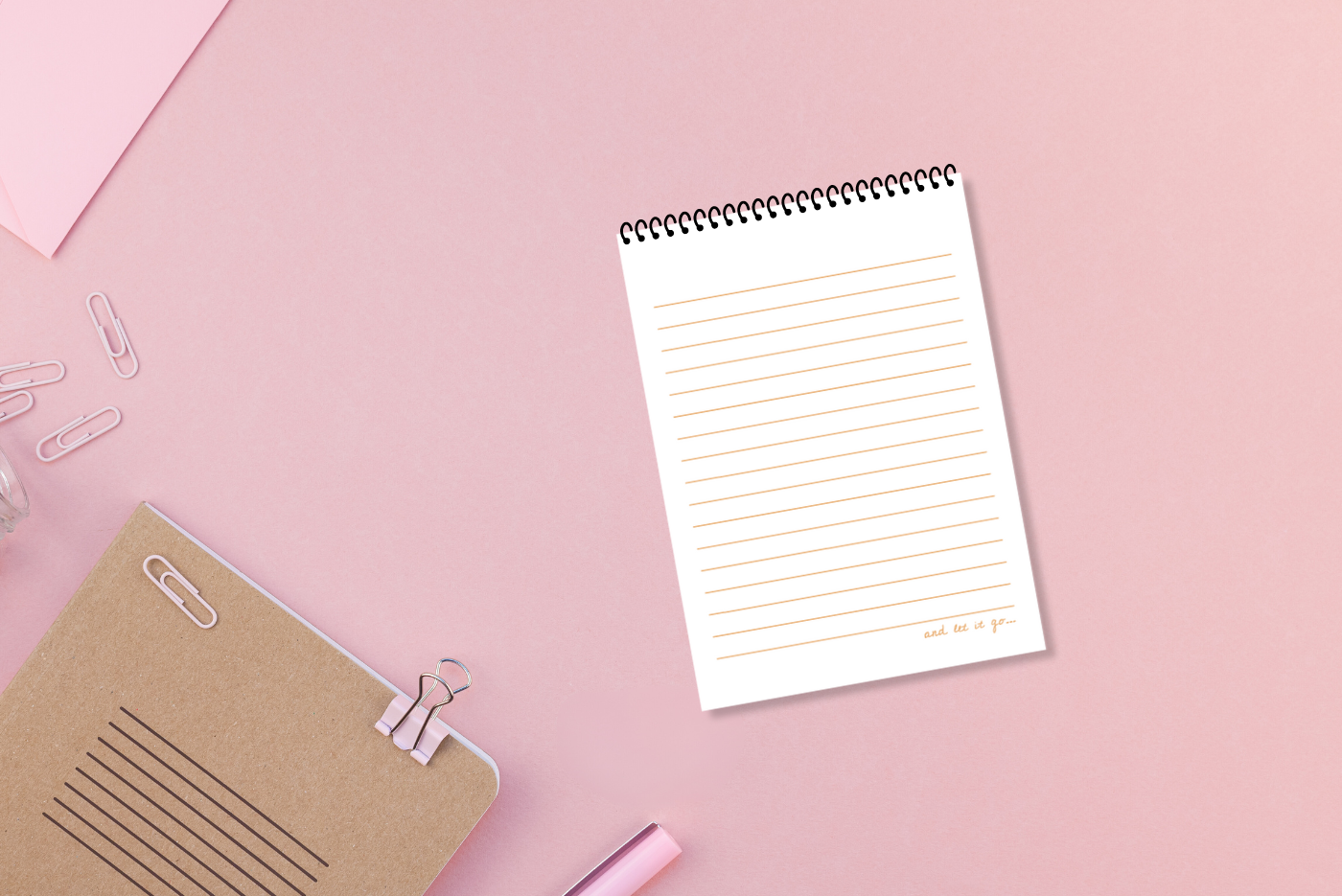 A white lined paper, wire-bound notebook with a pink cover featuring the title 'Worry Notes' in red text, along with a small decorative element on the top right by LSW for Heart Gallery