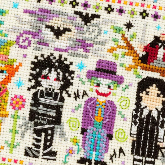 Cross-stitched pattern of colorful characters with a focus on a character in a purple top hat and suit.