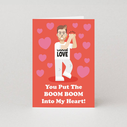 Card with a George Michael look alike holding a boom box and hearts on a red background