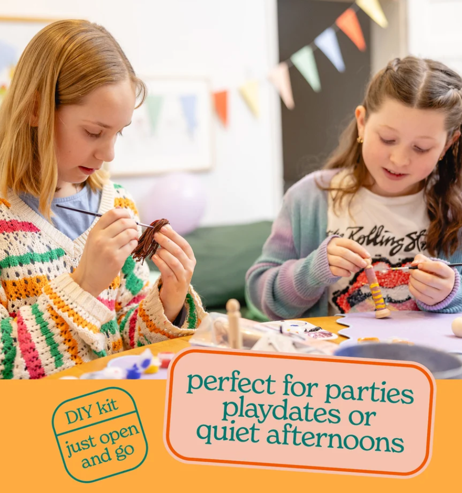 Two girls sitting at a table playing with a DIY craft kit, with text overlays that read 'perfect for parties playdates or quiet afternoons' and 'DIY kit just open and go'.