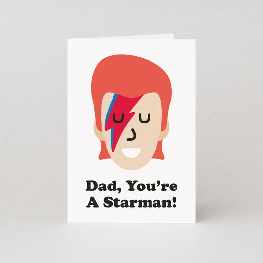 Greeting card with a stylized face and 'Dad, You're A Starman!' text on a white background