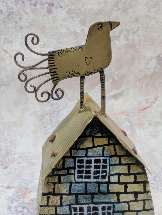 Frances Noon bird on a roof of house with orange door