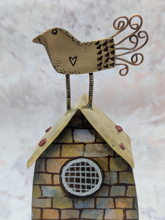 Frances Noon bird on top of house