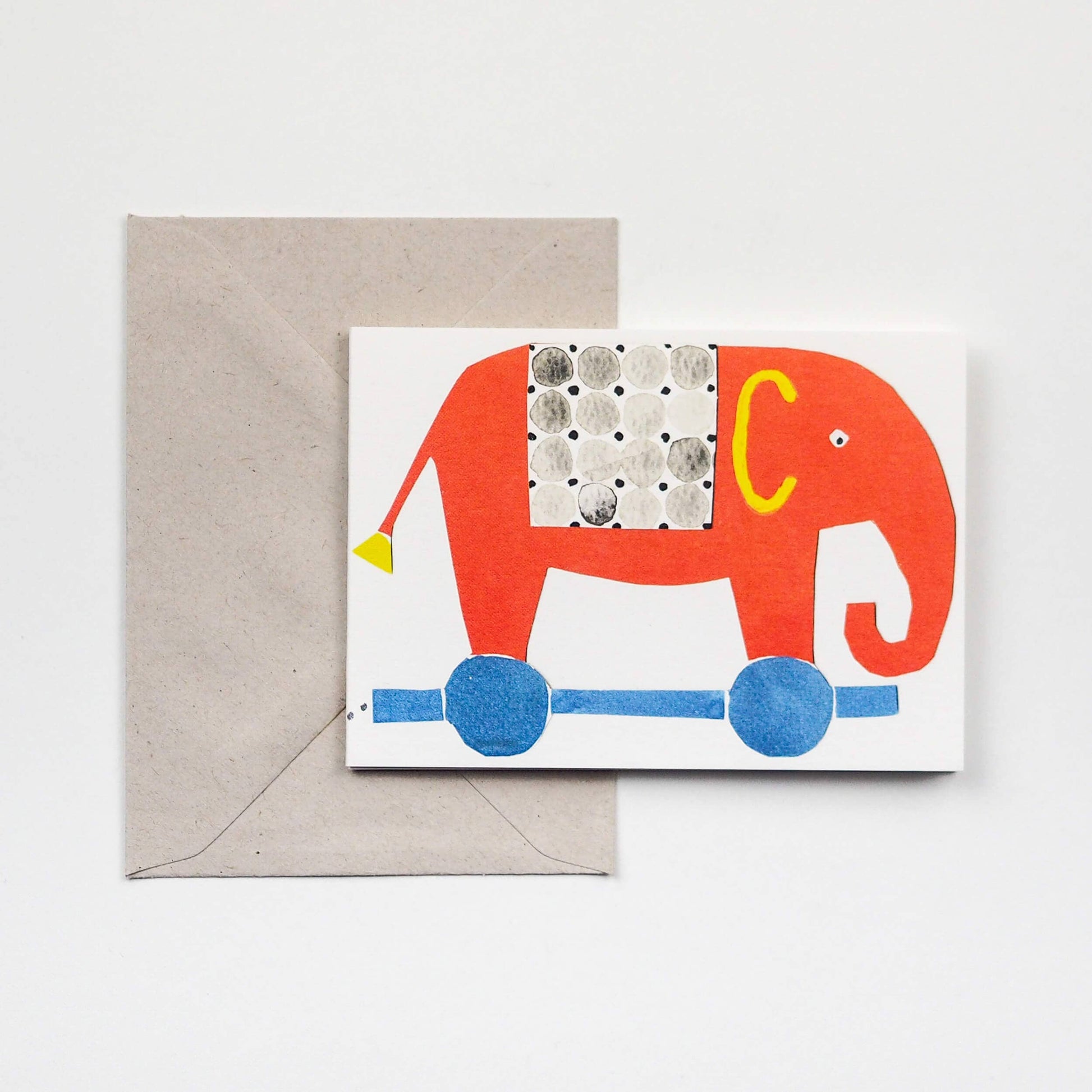 Card with a red elephant design and envelope on a white background