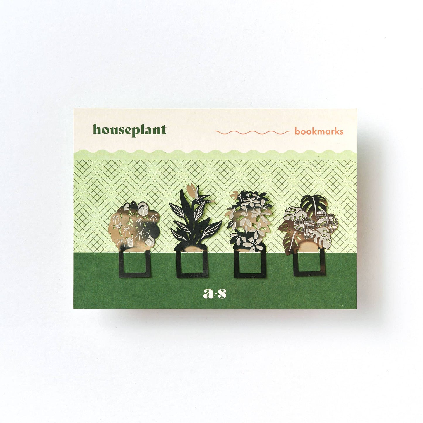 A set of four stainless steel bookmarks with a botanical design, featuring illustrations of houseplants such as Monstera delicious, Pilea peperomioides, Strelitzia, and Schefflera, presented on eco-friendly packaging by Another Studio for Heart Gallery