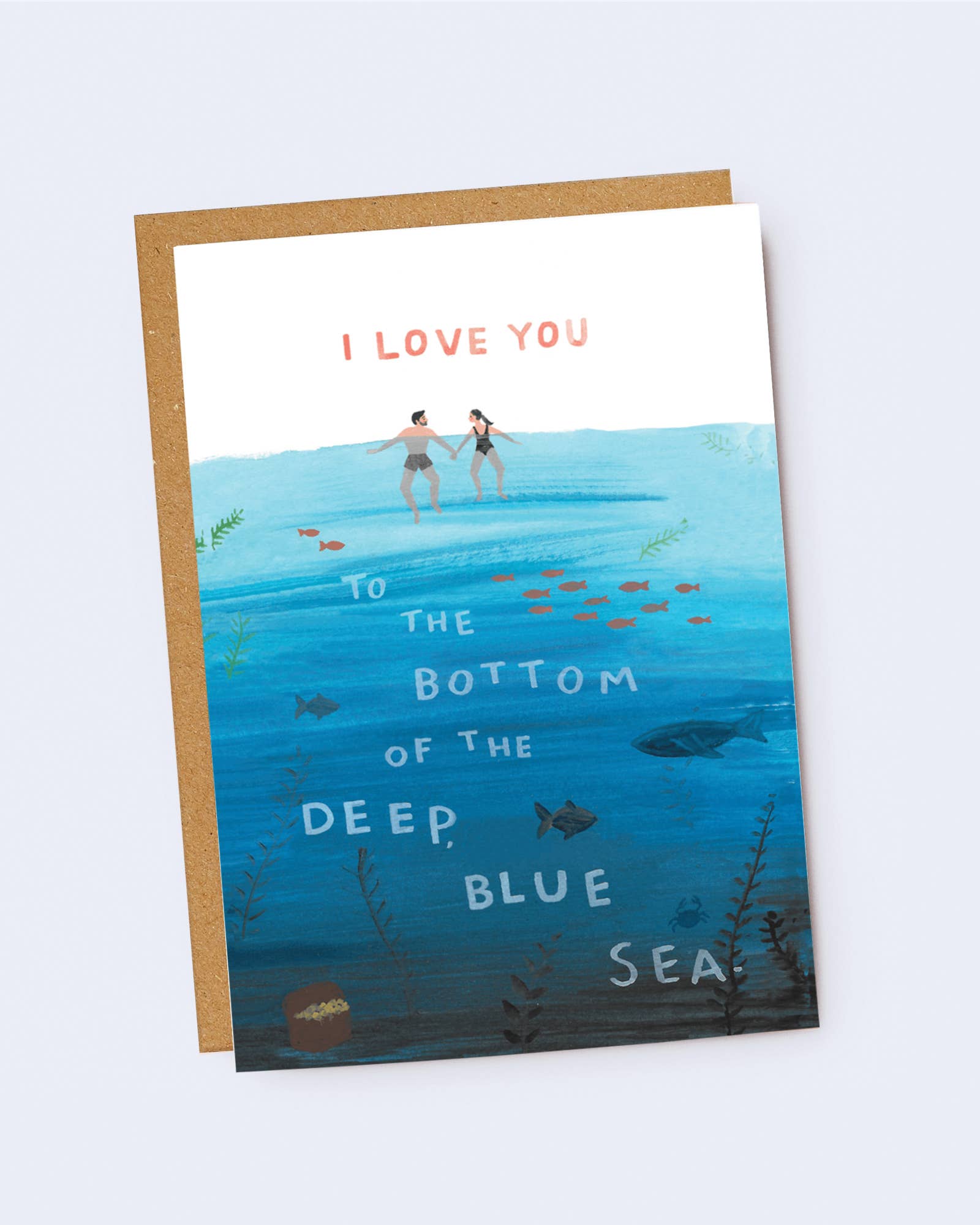 Greeting card with illustration of two people in the ocean and text 'I love you to the bottom of the deep blue sea' on a white background. Jade Fisher
