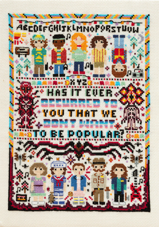 Cross-stitched pattern with characters and text on a white background inspired by Stranger Things
