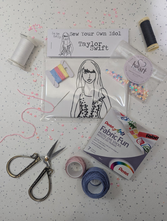 Sewing kit with materials and a Taylor Swift sew your own idol  on a polka dot background by Heart Gallery and Fat Hen and Flo