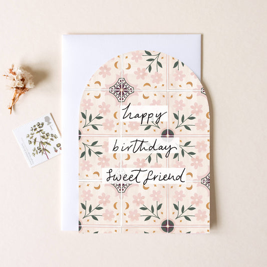 Floral-patterned card with 'Happy birthday, sweet friend' text on a beige background