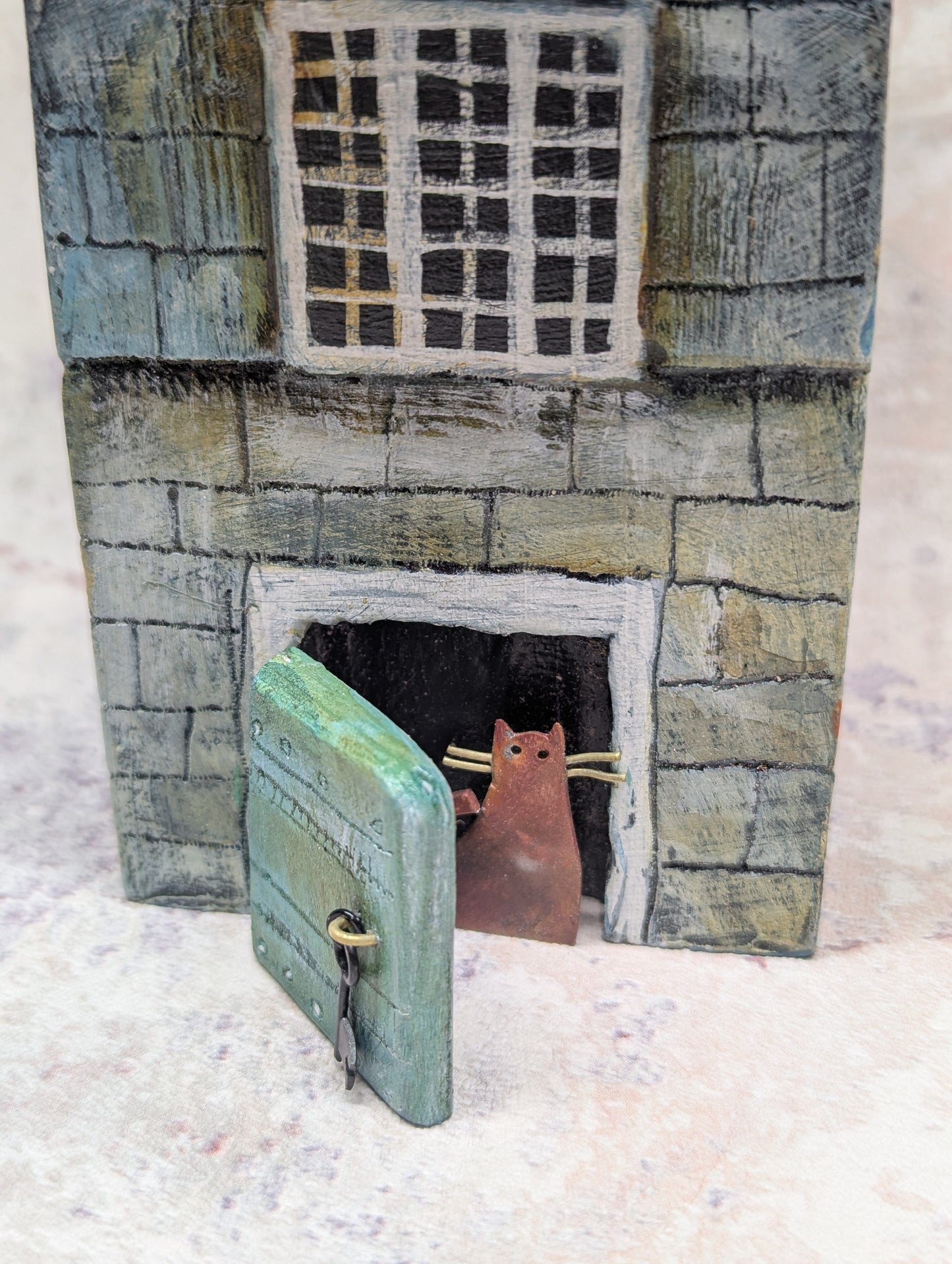 cat at the door of the large house by Frances Noon