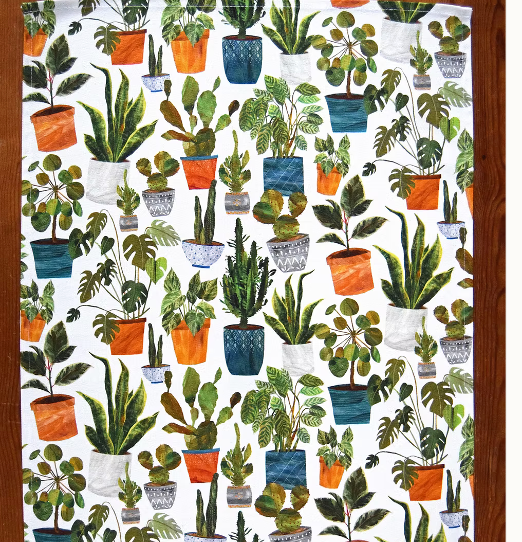 Tea towel by Freya snow with  potted plants on a white background