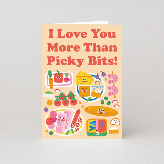 Card with colorful illustrations of food items and text 'I Love You More Than Picky Bits!' on a light gray background